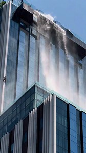 285K views · 1.6K reactions | BANGKOK - High-rise window cleaner hangs on for dear life as massive earthquake hits Bangkok. The hapless worker had just his safety harness, helmet and rope to protect him. He can be seen putting his head down and clinging onto the edge of the building, as tons of water from a rooftop swimming pool poured over the sides. cr : @freeverar on TikTok www.tiktok.com/@freeverar/video/7486744716520836359 | Stay in Thailand | Facebook
