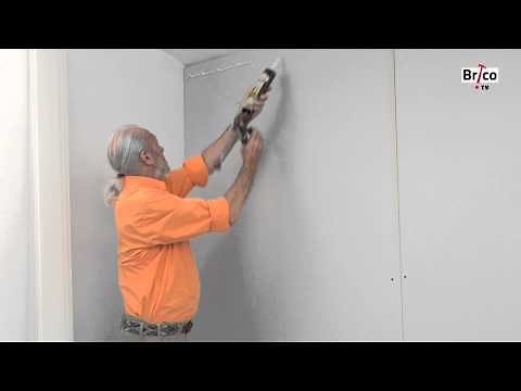 Glue PVC paneling to the wall