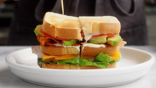 What makes this club sandwich the ULTIMATE? Oven roasted turkey, crispy bacon, fresh veggies, and a homemade garlic aioli! This layered turkey club sandwich takes a little time to build, but it’s worth every step. Get the recipe: https://bit.ly/3nCtsOY | Simply Recipes