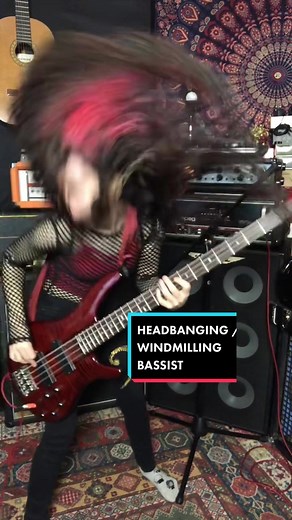 Female Bassist Shredding a Metal Solo
