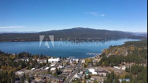 Large aerial of Payette Lake with the town of McCall on the side of the water.