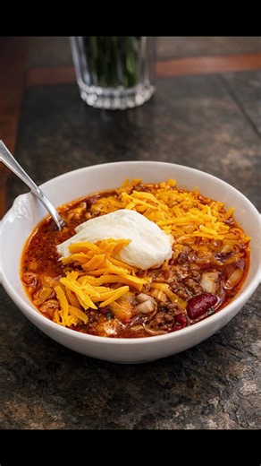 I came in second place with chili. Sharing it because I like it. Chili cook-off recipe Ingredients * 5 strips uncooked bacon chopped¹ * 1.5 large yellow onion diced (about 1 cup) * 1 red pepper diced * 5 dark chocolate chips * 2 serrano peppers, diced * 3 cloves garlic minced (about 1 Tablespoon) * 3 1/2 lbs ground beef * 1 Tablespoon brown sugar * 2 tbsp Tablespoon chili powder * 1 Tablespoon ancho chili powder * 1 Tablespoon Adobo * 1 ½ teaspoons smoked paprika * 1/2 teaspoon oregano * 2 teasp
