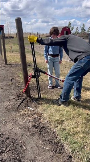 Removing wooden fence post with a hand jack and Pro-Pull Post Puller