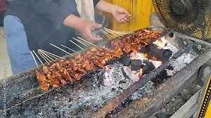 Satay, or sate in Indonesia, is a Javanese dish of seasoned, skewered and grilled meat, served with a sauce. Satay originated in Java.