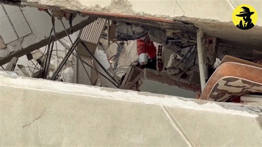 Venezuela earthquake aftermath — Miami-Dade Fire Rescue's search team sifts through debris with K-9
