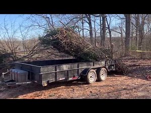 Unloading brush from a utility trailer quickly