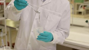 Scientist mixing solution in lab