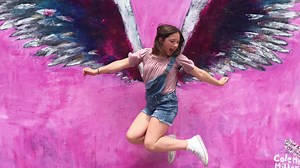 Gracie Muehlberger is getting wings. The artist behind the iconic angel wings painted on buildings in Los Angeles is creating one at Saugus High School today. The mural is designed to bring joy and healing to the campus two weeks before the anniversary of last year’s shooting. The Muehlbergers don’t want people to remember the tragedy for the bloodshed. Instead, remember it for the joy Gracie and Dominic brought to campus — two beacons of light to be remembered side-by-side. A Spongebob mural by