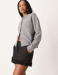 ASOS DESIGN tailored ruffle hem shorts in black | ASOS