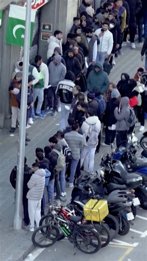 Spain's left-wing government announced it will grant legal status to around 500,000 undocumented immigrants. The impact of the announcement was seen almost immediately in Barcelona. | DW News