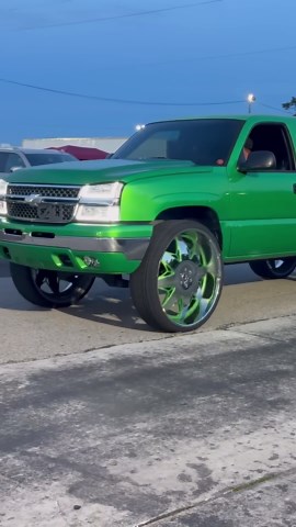 Candy slime green Chevy truck on 32’s riding