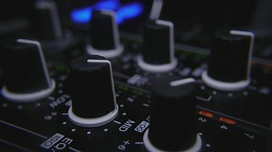 Adjusting knobs in mixer controller - Free Stock Video