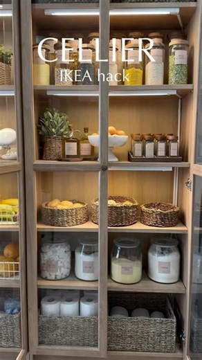 Linda | IKEA Hacks & Ideas 💡 | Home Inspiration | DIY on Instagram: "IKEA PANTRY HACK 💡 This is a fabulous hack using IKEA’s oak-colored Billy bookcases with Oxberg doors to create a pantry cupboard. With LED Skydrag lights and stylish jars (bocaux), this setup is both practical and aesthetically pleasing. 🏡✨ We love 💕 how functional and elegant this storage solution is! Special shoutout to @kawtar_decoo for this creative idea! 🎨 💡 You can check ou