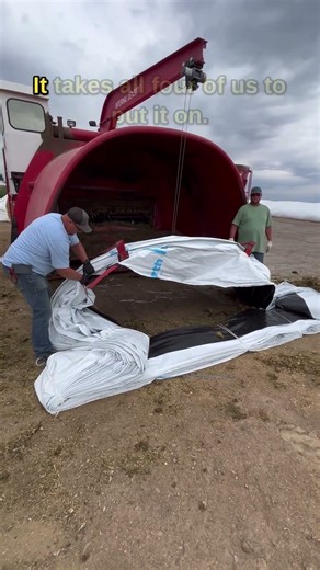 Changing the bag on the hay bagger