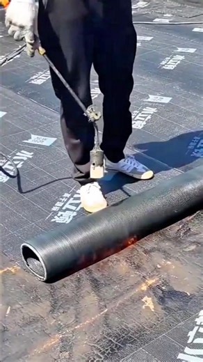 Carefully Installing a Waterproofing Membrane Using a Torch for Durable Roof Protection #shorts
