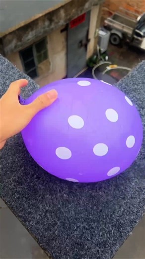 Experiment: Dropping colorful emoji water balloons from a height