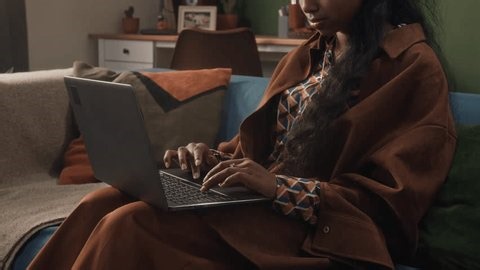 clip-3996452853-tilt-shot-south-asian-female-remote-employee