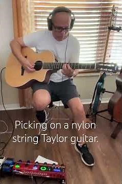Picking on a nylon string Taylor guitar.