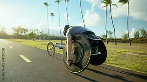 Disabled wheelchair paralympic athlete in wheelchair racing chair outside working out healthy lifestyle