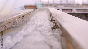 Water running through sluice box mining attraction. Visitors can search for rare gemstones and minerals.