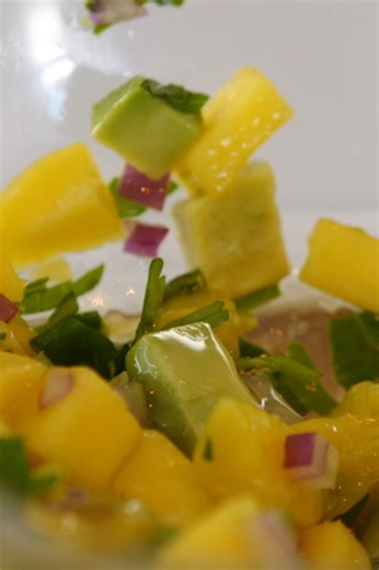 Fresh mango salsa with avocado, jalapeño, and red onion
