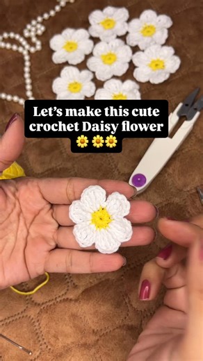 Crochet knotique on Instagram: "Quick tutorial 🌸 Crochet Daisy flower in just 5 min. ✨ Crochet pattern :: Center (yellow) MR, ch1, 12SC , slst Petals (white) [Ch3, (3TC) in next same stitch, Ch3, slat in next stitch] *6 Make 6 petals Tadaaaa….✨ your cute Daisy flower is ready.. Follow for more tutorials :: @crochet_knotique #crochetpattern #giftideas #hairaccessories #customisation #miniflower #cutethings #crochetknotique #handmadewithlove #reels (Crochet, tutorials, flowers, crochet Daisy, min
