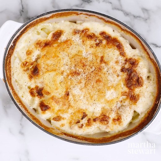 In this classic dish, thinly sliced potatoes soak up all the goodness of a milk-and-cream mixture that has been spiked with nutmeg. A sprinkling of grated Gruyere cheese on top becomes gooey in the oven. https://trib.al/uGx9Gay | Martha Stewart