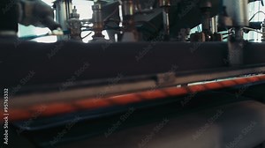 professional equipment on a garment factory in working process slow motion