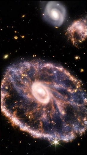 The Cartwheel Galaxy Explained | A Cosmic Ring Formed by Collision #CartwheelGalaxy #astronomy
