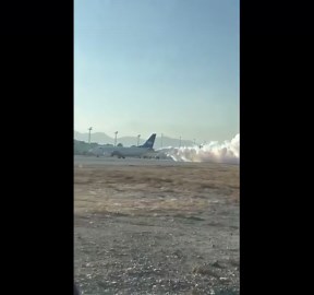 Smoke pours from exhaust of plane at Afghanistan airport