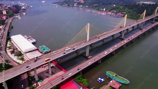 mandovi river bridge with Cruise terminal and Atal Setu bridge at panaji, goa, india. day time, semi circle shot, drone shot, 4k.