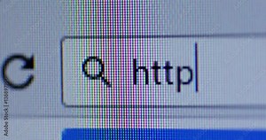 Video footage of a cursor typing http on the browser bar. Internet Search Concept