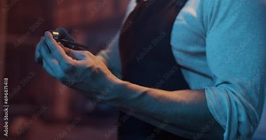 Crop male master using calipers while measuring detail at work