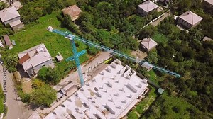 View of construction site from point of view of drone, from above. Foundation and first floor were built, construction of monolithic columns with protruding reinforcement. Developer, urban housing.