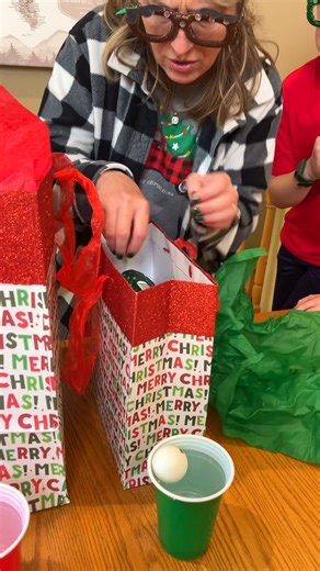 Crazy Christmas Toss Challenge 🎁 Dad and family toss the ball in the water cup for small, medium, large, or giant bag prizes. Super fun for a Holiday party. This video was produced by Peter B, Network Media, Benson Bros. | Paul & Kezzy
