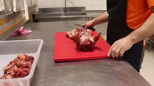 time lapse butcher butchering carcass nutria separating bones and meat in different directions