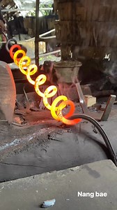 Red-Hot Spring Coil Pulling | The First Step in Farming Tool Making #blacksmith #viking #VikingCraft #forging #metalwork #handforged #AncientHistory #norway #CulturalHeritage #Americaviral #brazil #ironwork #america #usa #usareels #tradisionalblacksmit | Nang Bae