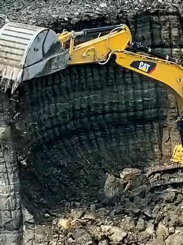 Caterpillar 352F Excavator Loading a Construction Truck