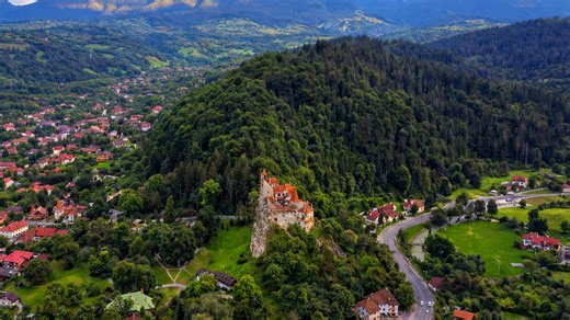 Bran Castle standing above Romania’s lush landscape
