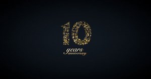 10 years anniversary motion graphic 4K footage with golden color particles and number. Background with alpha channel