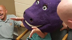 WATCH: A Girl Getting TRAPPED Inside A Barney The Dinosaur Head Is Too Funny For Words