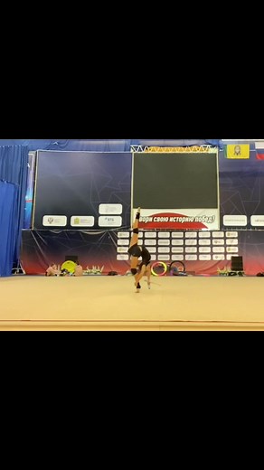 Female Gymnast's Stunning Rhythmic Routine Performance