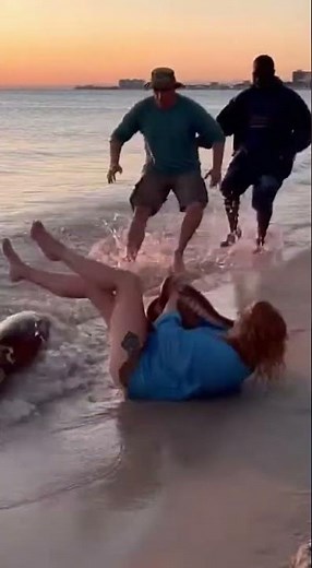 The octopus grabbed the woman on the beach
