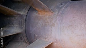 Close-up of a jet engine combustion chamber made of titanium and heat-resistant steel. Engine for military missiles. The nozzle of a rocket engine in which the combustion of fuel occurs.