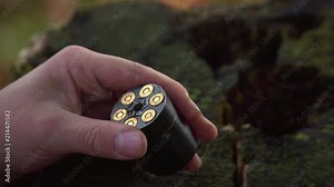 Close-up loading a bullet into a 6-gun revolver. Stock Video