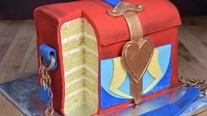 4.6M views · 587 reactions | To make Descendants Evie Red Box Crossbody Bag cake I used my delicious recipes : Velvet Vanilla Pound Cake https://www.hanielas.com/baby-kulp-cake-velvet-vanilla-pound/ Swiss Butterecream https://www.hanielas.com/swiss-buttercream/ Marshmallow Fondant https://www.hanielas.com/candy-cane-cupcake-toppers/ | Haniela's | Facebook