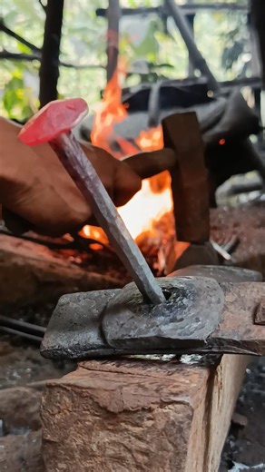 A blacksmith is making nails.#blacksmith​