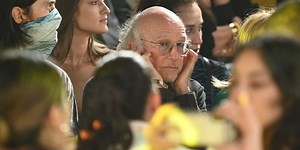 Larry David has explained why he was plugging his ears at New York Fashion Week