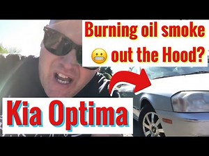 2002 Kia Optima diagnose oil leak burning and valve cover gasket. Remove and Replace GASKET.