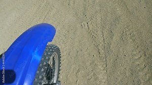 Motocross bike slowly rides, view from the wing of a motorcycle. Point of view of biker. Slow motion Close up